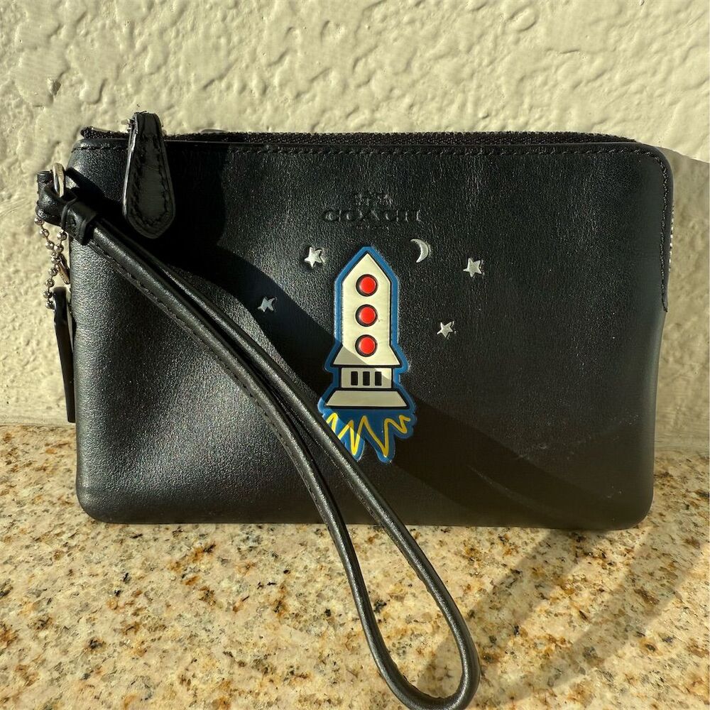 Coach Women's Black Wristlet with NASA Rocket Emblem & Star Accents